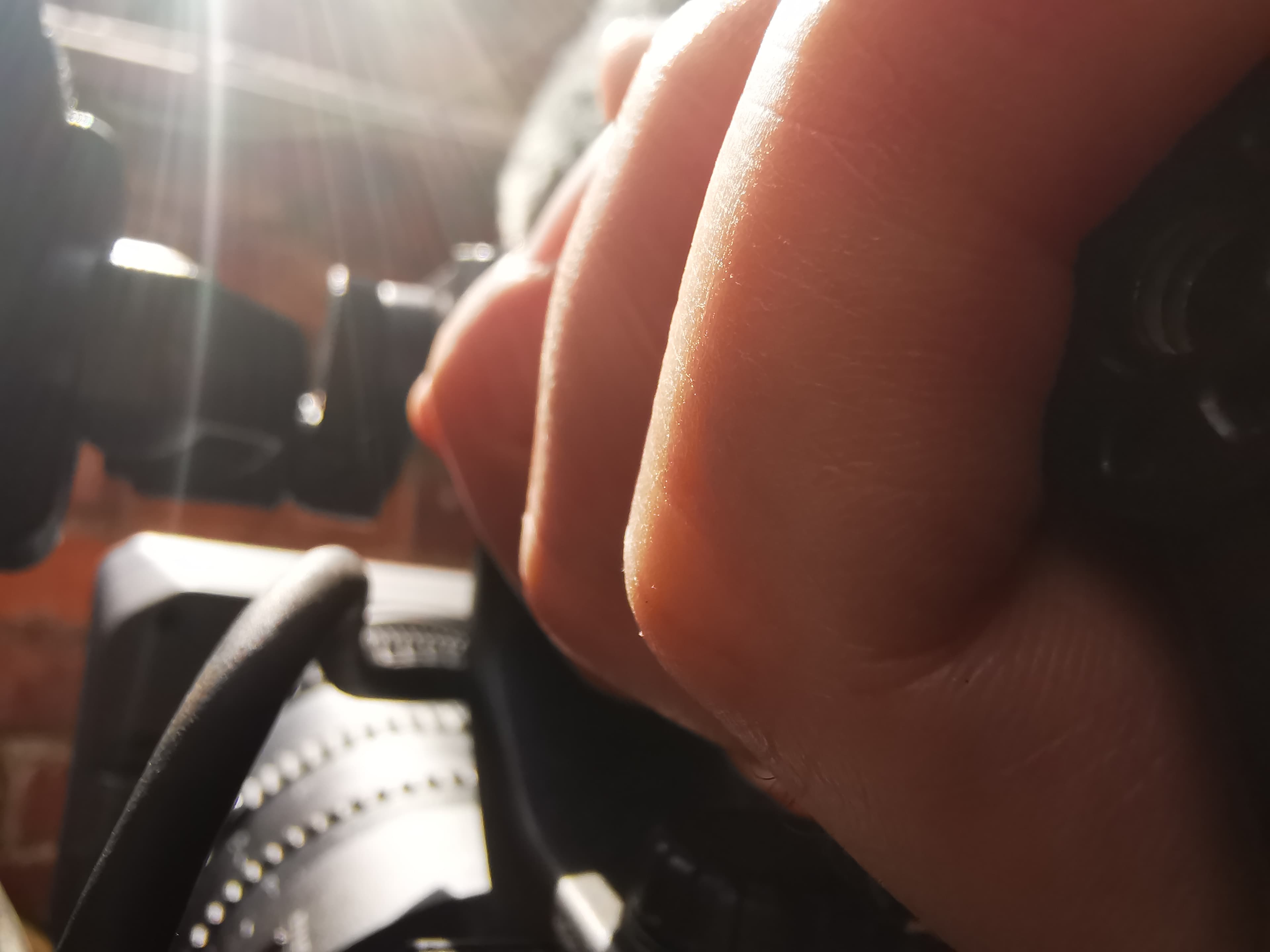 A close up of a hand holding a video camera